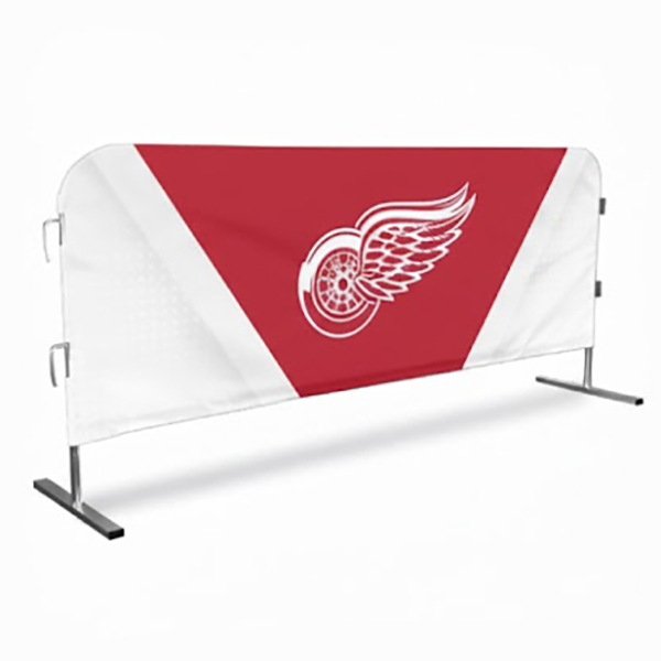 Red and white banner with a logo on a stand